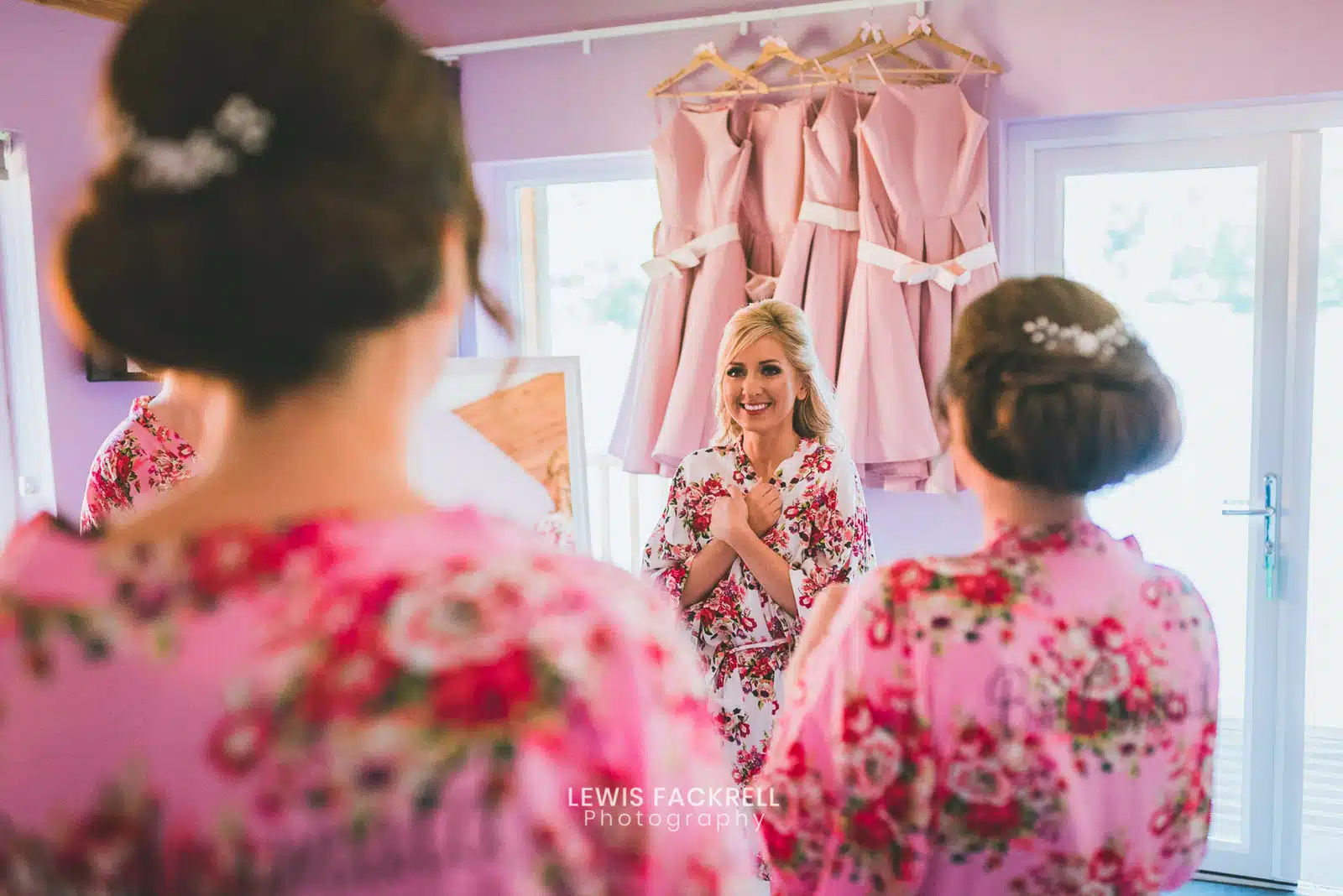 Bride and her bridesmaids excited at the lodges at canada lodge wedding venue