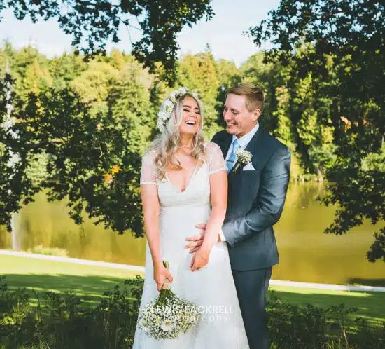 Cardiff wedding photography at Canada Lodge in summer of bride & groom laughing