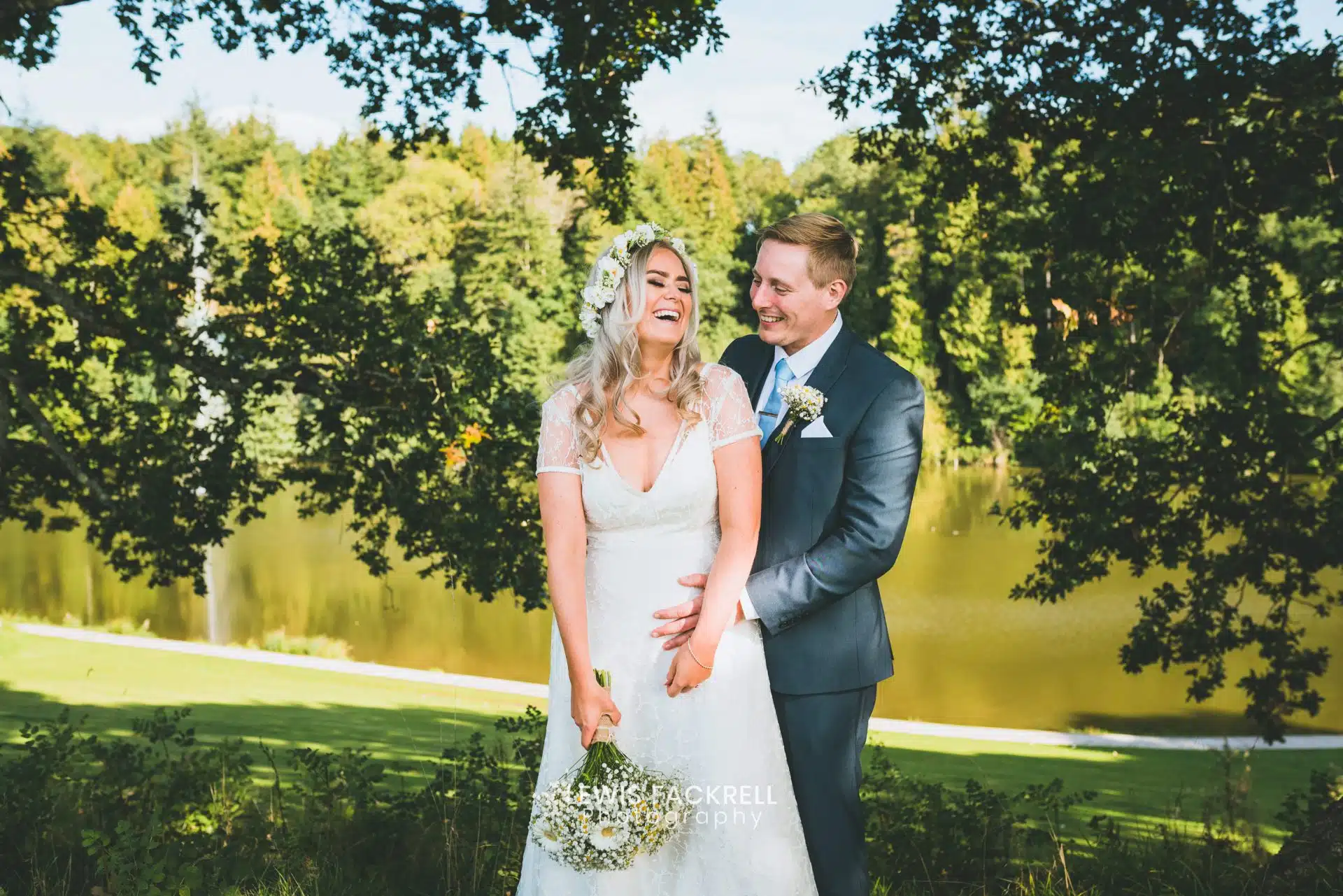 Cardiff wedding photography at Canada Lodge in summer of bride & groom laughing