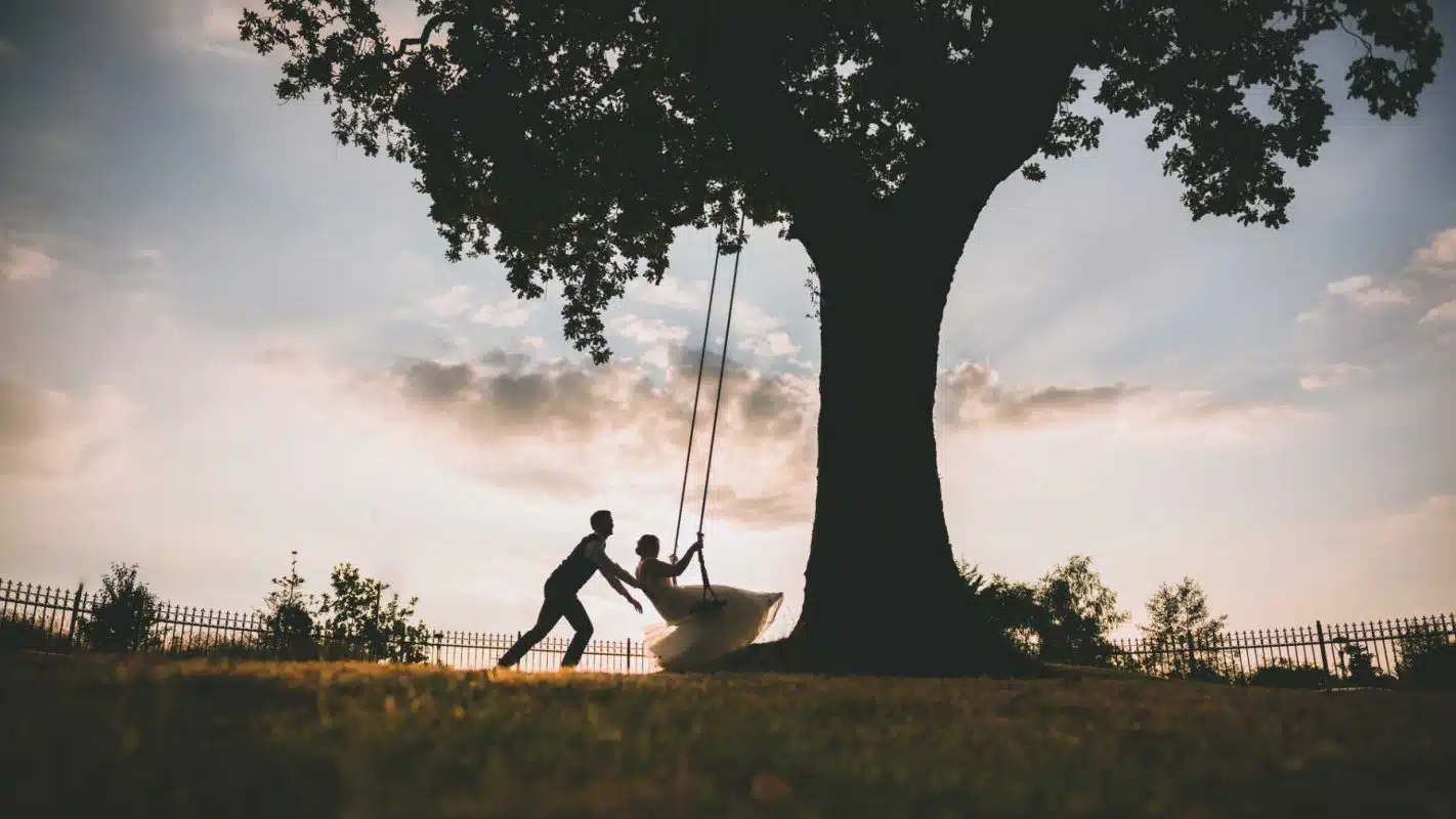 Cardiff wedding photographer south wales couple playing on swing at canada lodge