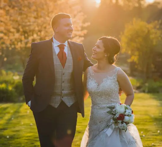 Miskin manor wedding photography of Bride and groom walking around the venue