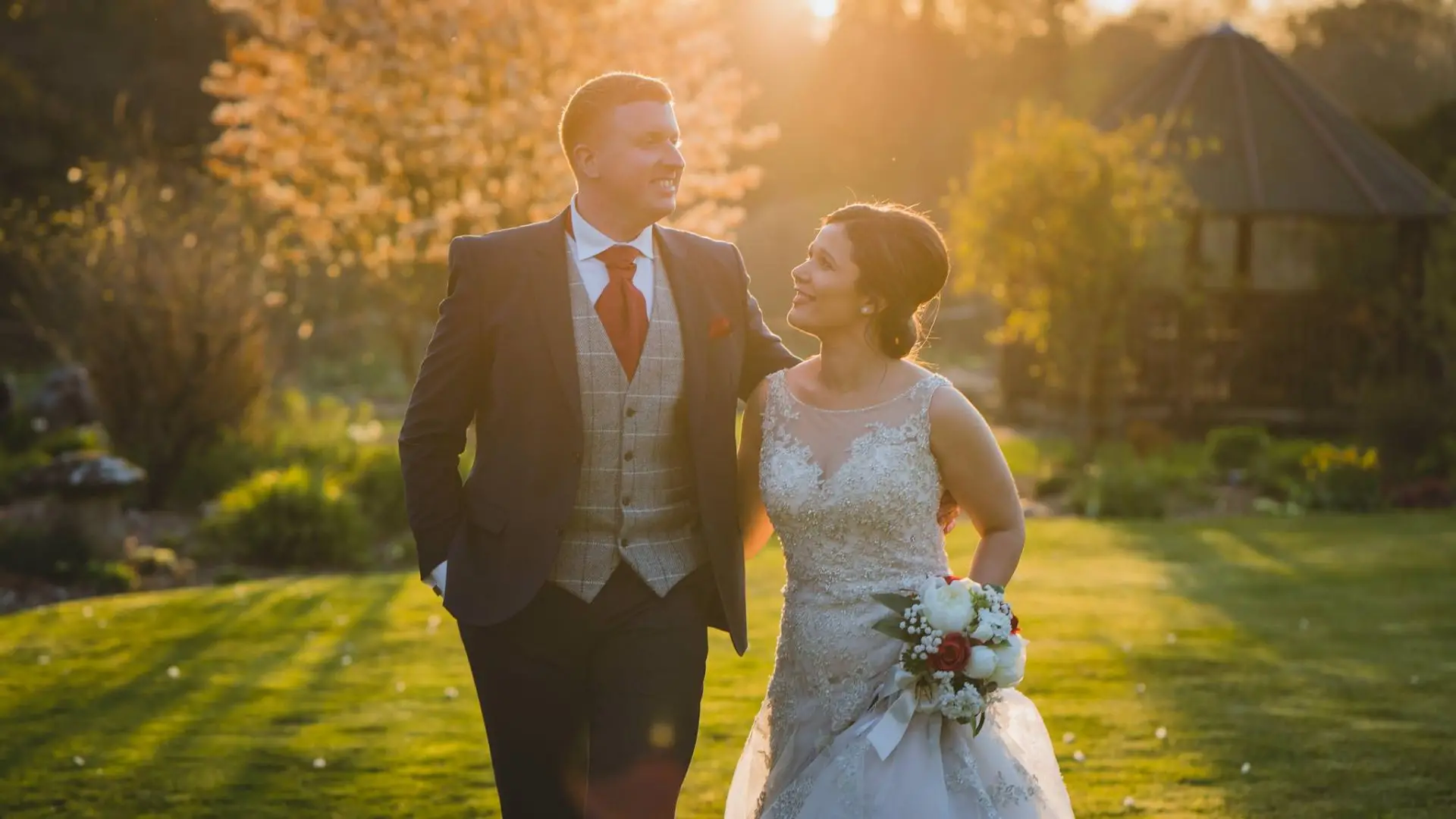 Miskin manor wedding photography of Bride and groom walking around the venue