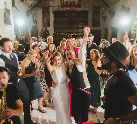 Dance floor at Miskin manor with guests and couple dancing having fun