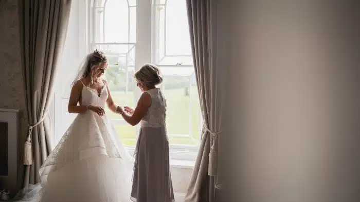 122-Wedding-Photography-at-St-Tewdrics-House-Chepstow-Jess-Luke-Lewis-Fackrell-Photography mother dressing bride in St Tewdrics House