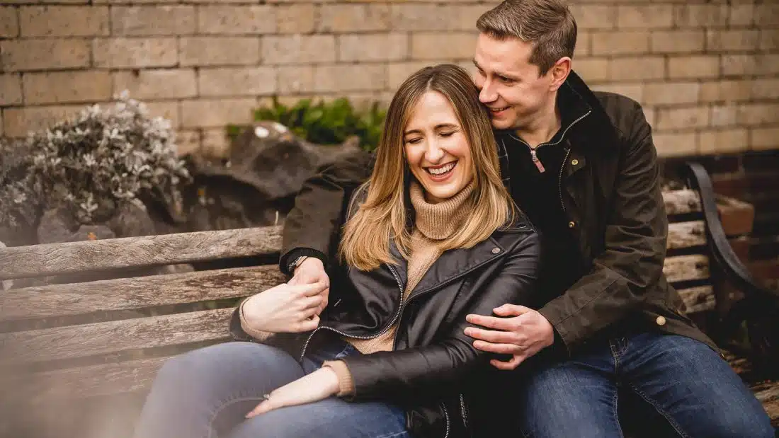 couple holding each other during their pre-wedding photo shoot at Southerndown
