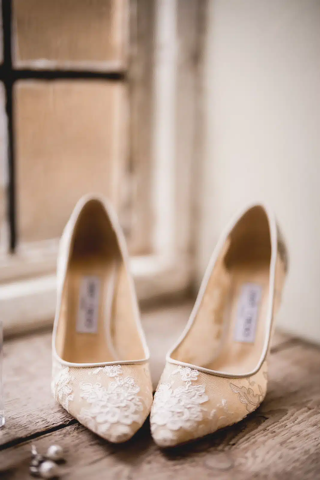 Wedding shoes on the windowsill at the Barn at Upcote