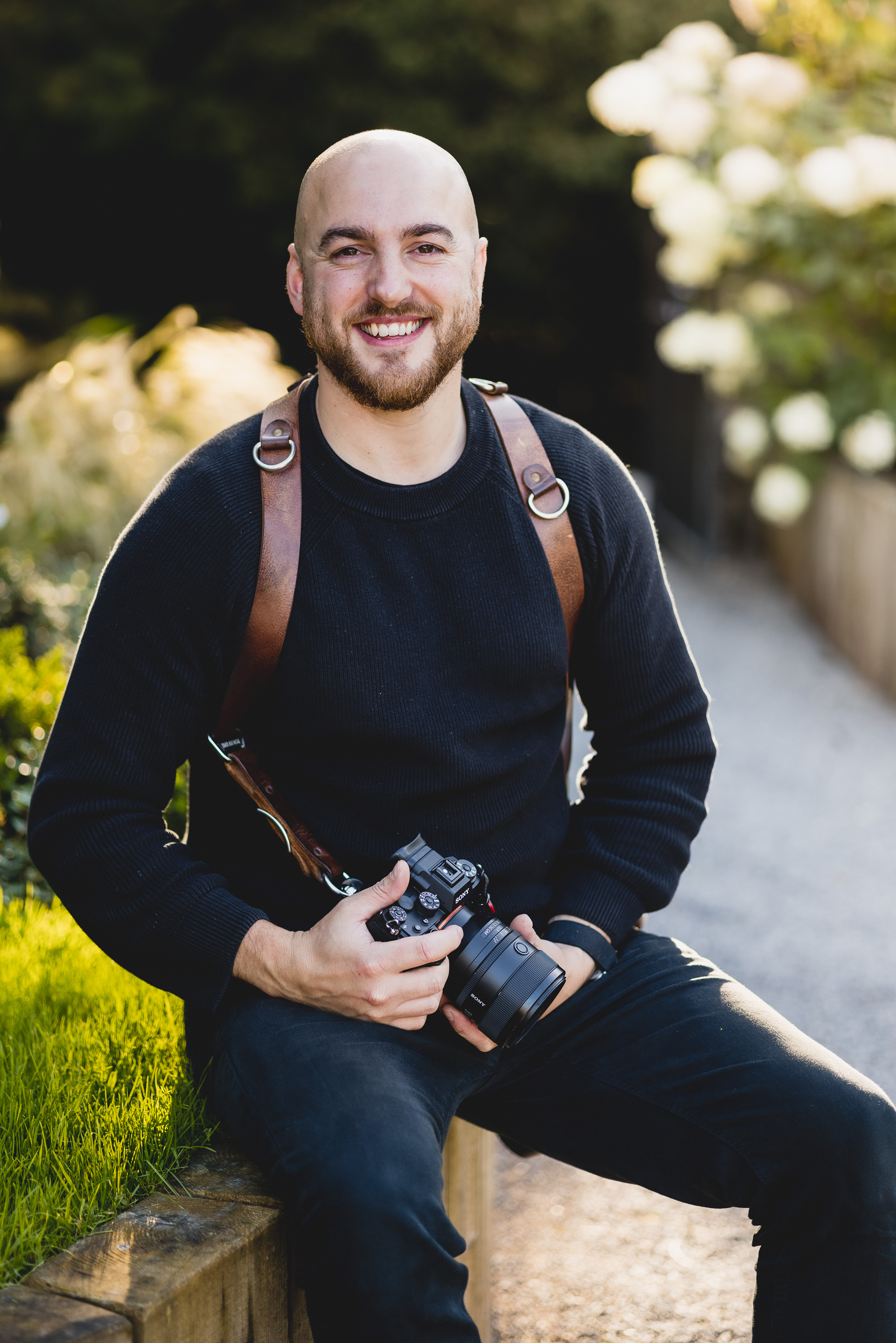 Lewis Fackrell smiling with his camera