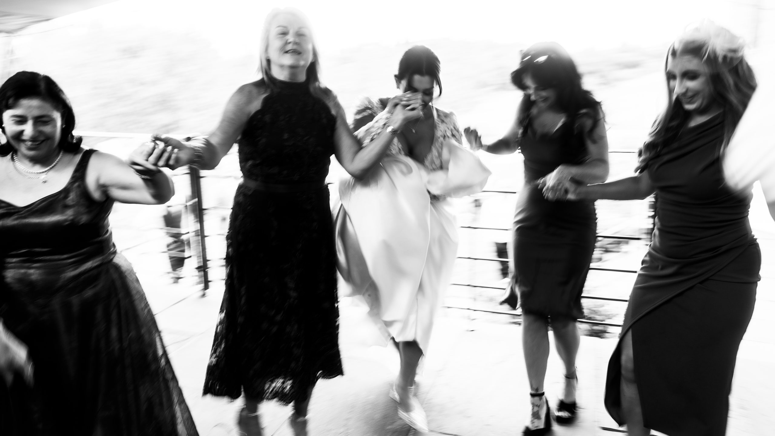 Guests dancing in a line at Llantilio House