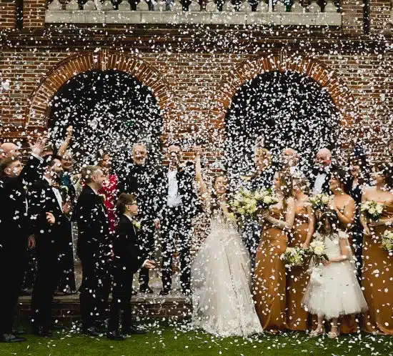confetti at sant ffraed house over newly married bride and groom
