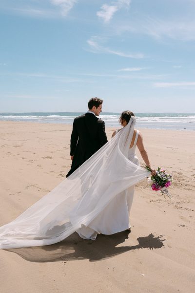 bride and groom beach wedding at Nolton Coast.