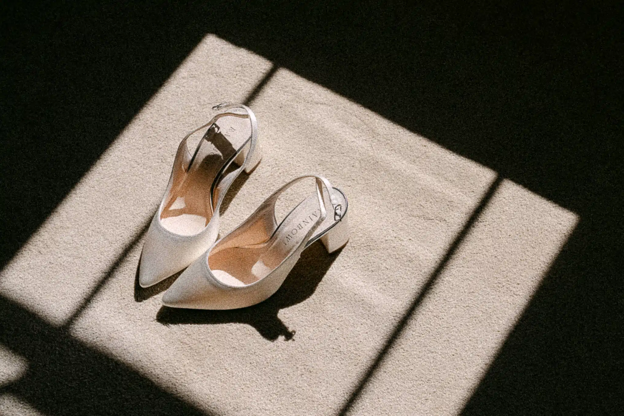 Jess’s wedding shoes in a strip of morning light