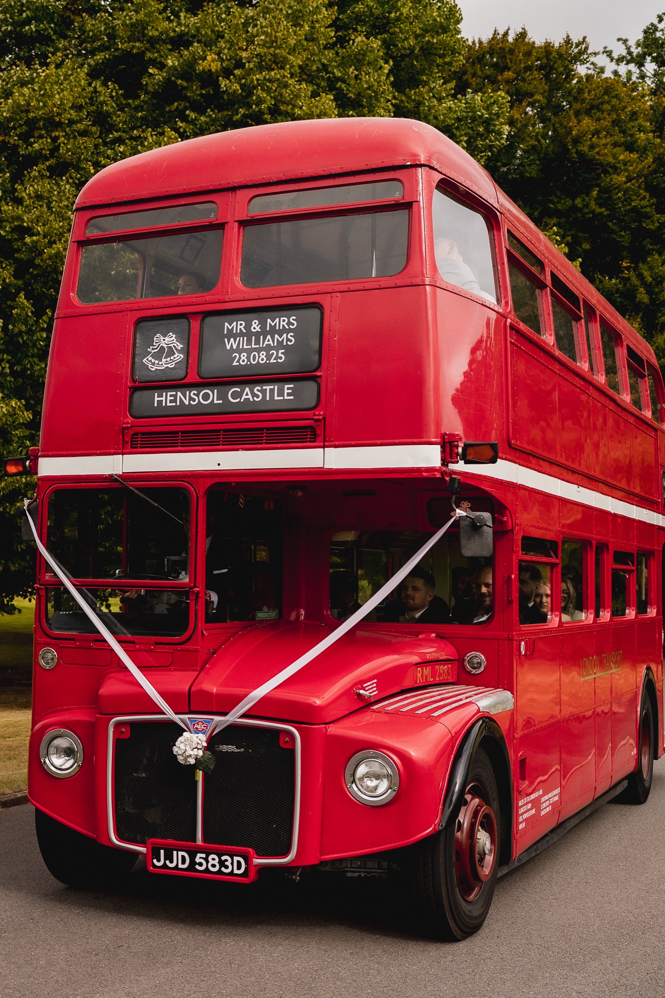 A red Routemaster bus bringing the guests to Hensol Castle