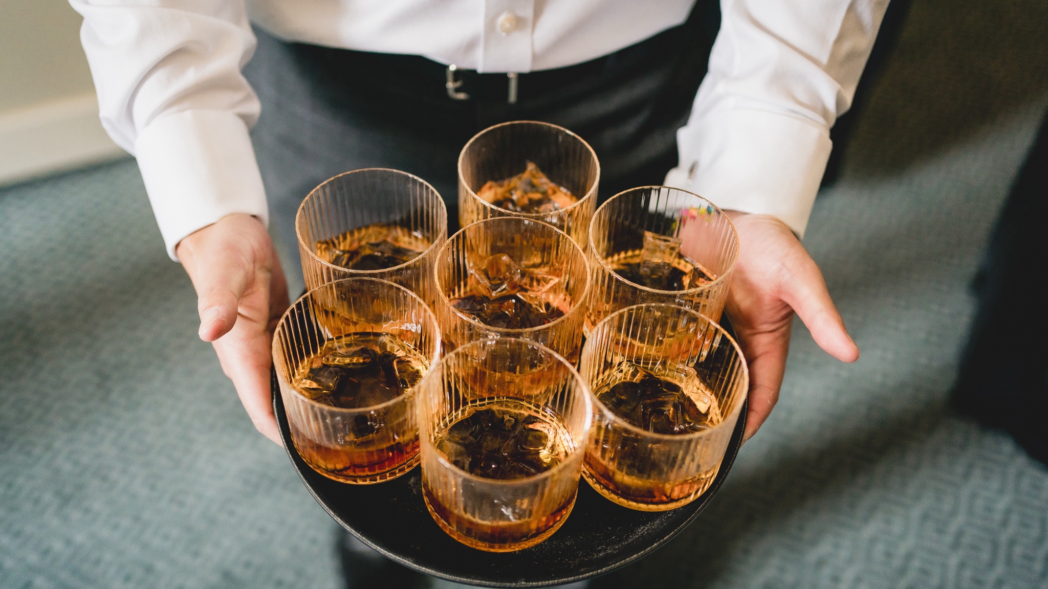 A tray of drinks carried out to the lawn