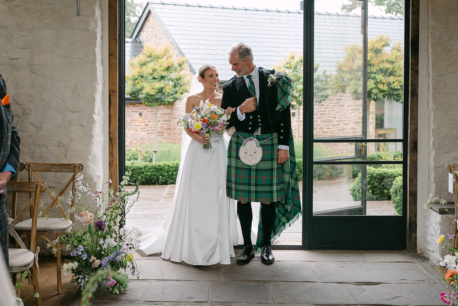 Olivia with her father in his kilt before the ceremony