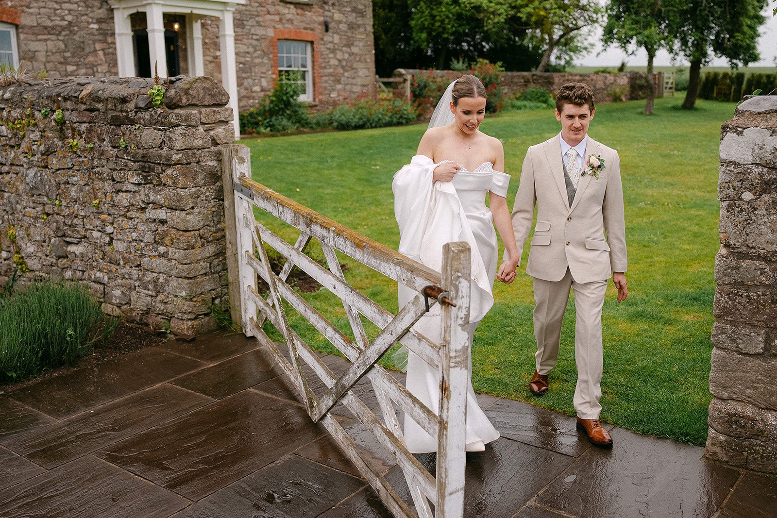 Olivia and Nathan walking through the farm gate