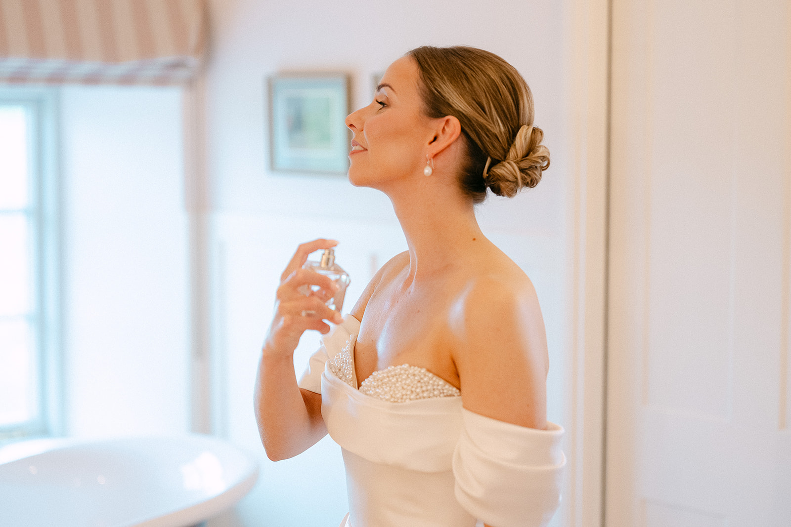 Olivia with her perfume by the bedroom window