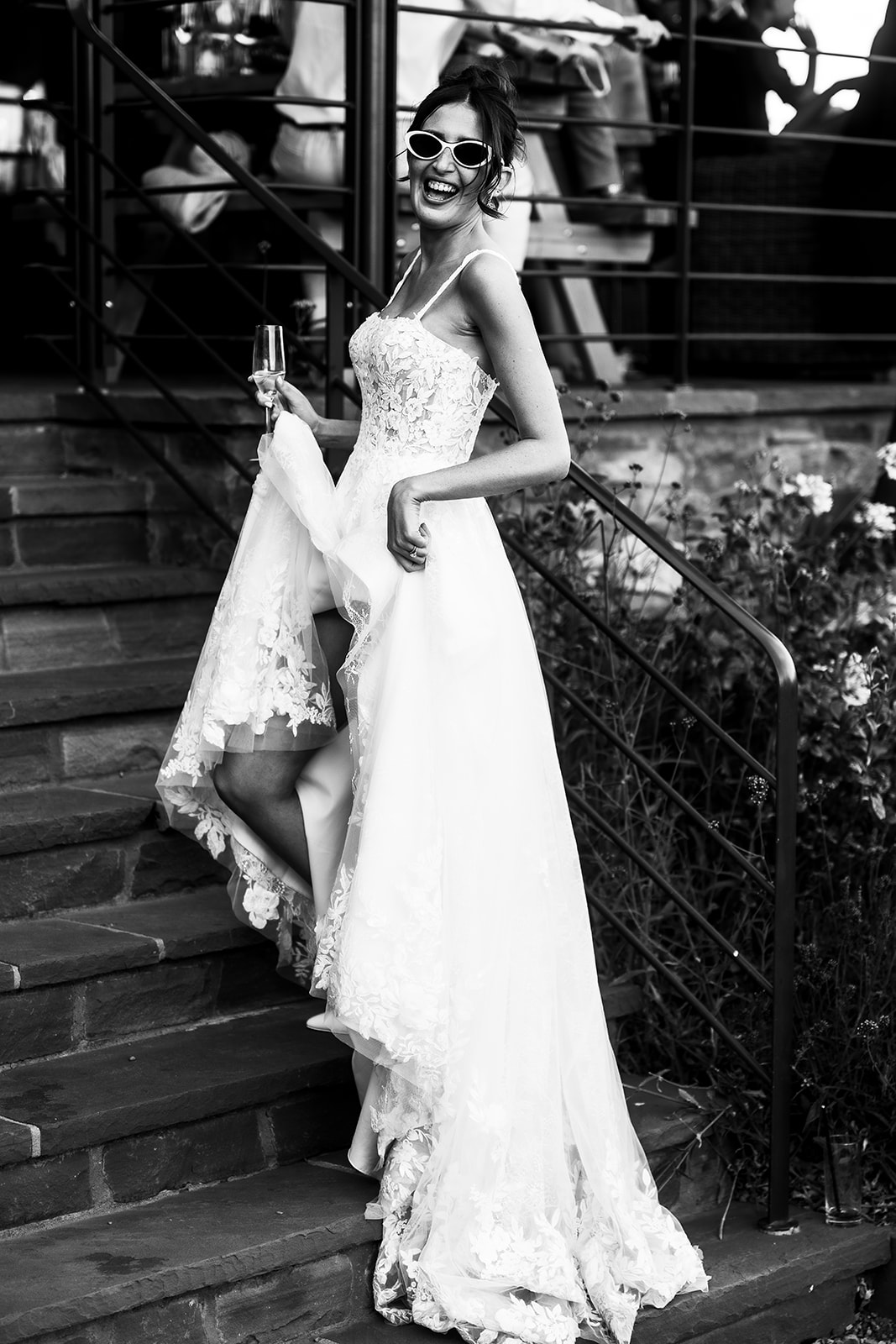 Rosie walking down the stone steps, in black and white