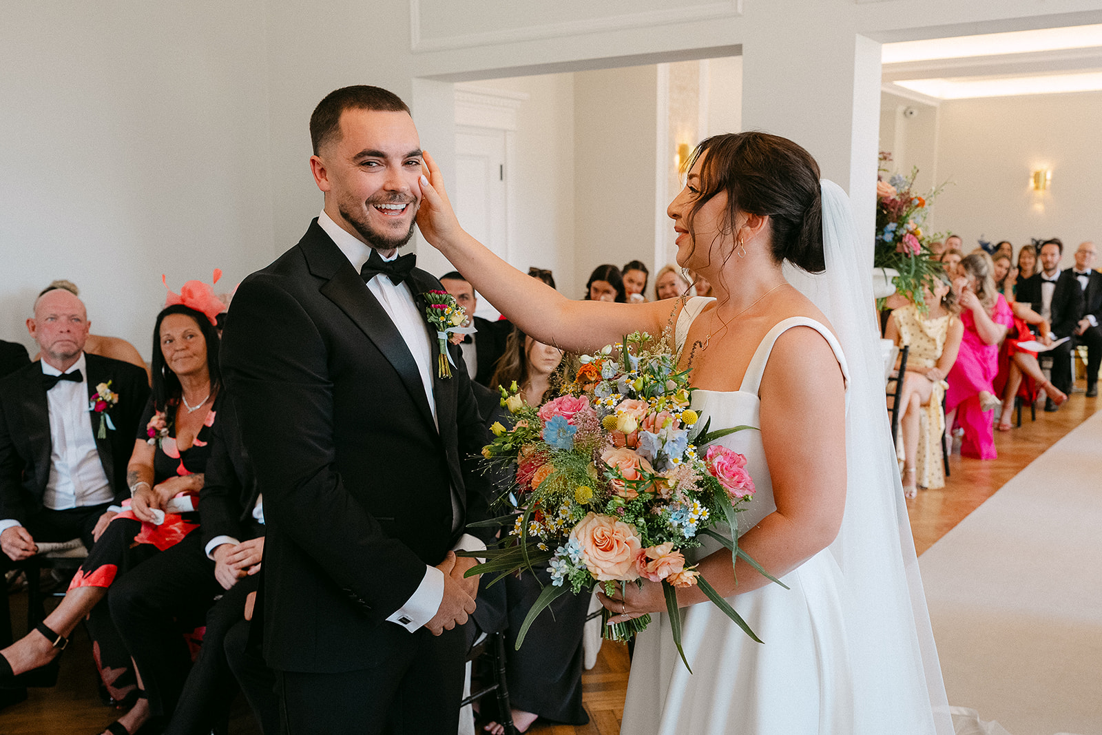 Emily touching Steve’s face at the ceremony