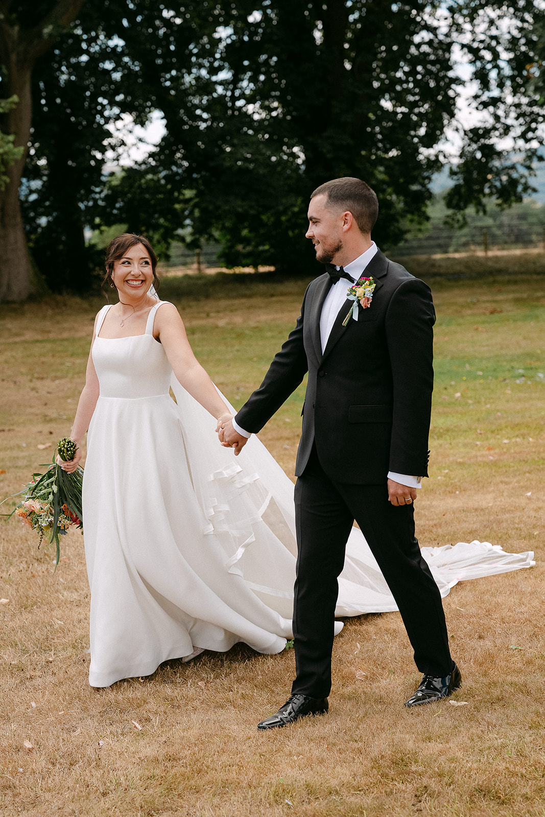 Emily and Steve walking across the lawn