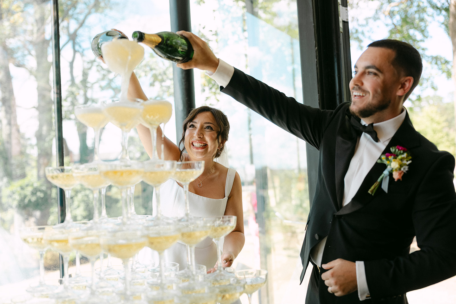 Steve pouring champagne into the coupe tower
