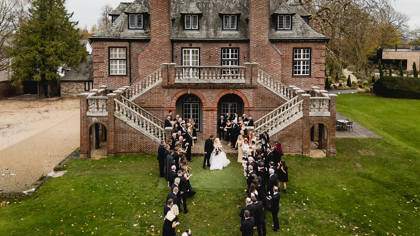 Sant Ffraed House from above, guests lining the path to the double staircase