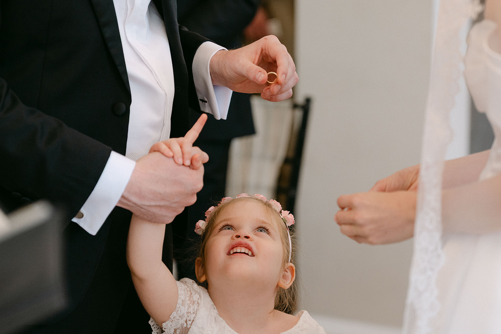 A small hand holding on during the ceremony