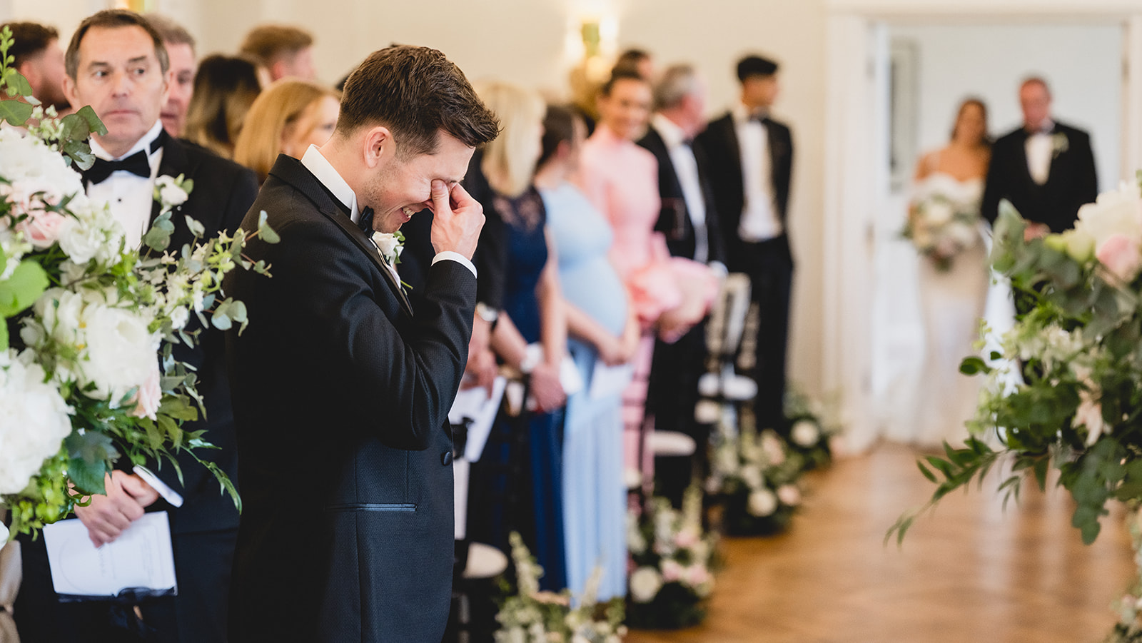 Nick wiping away a tear as Sophia walks in