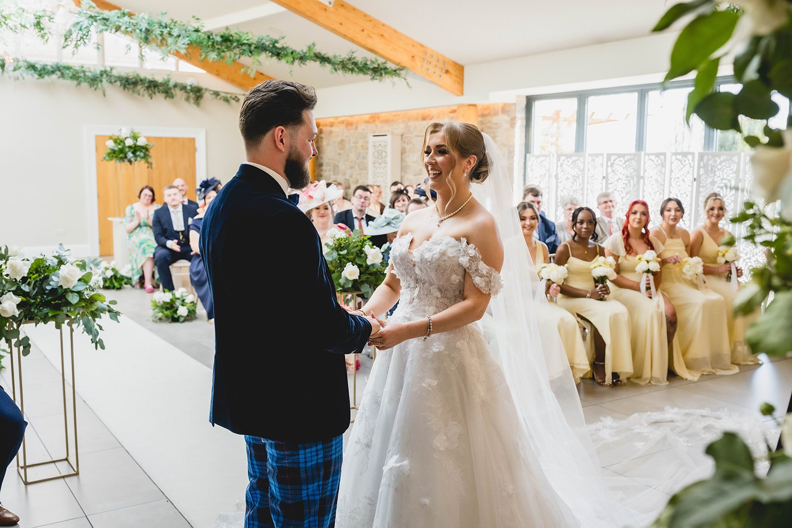 Eilir and Jack holding hands during their ceremony