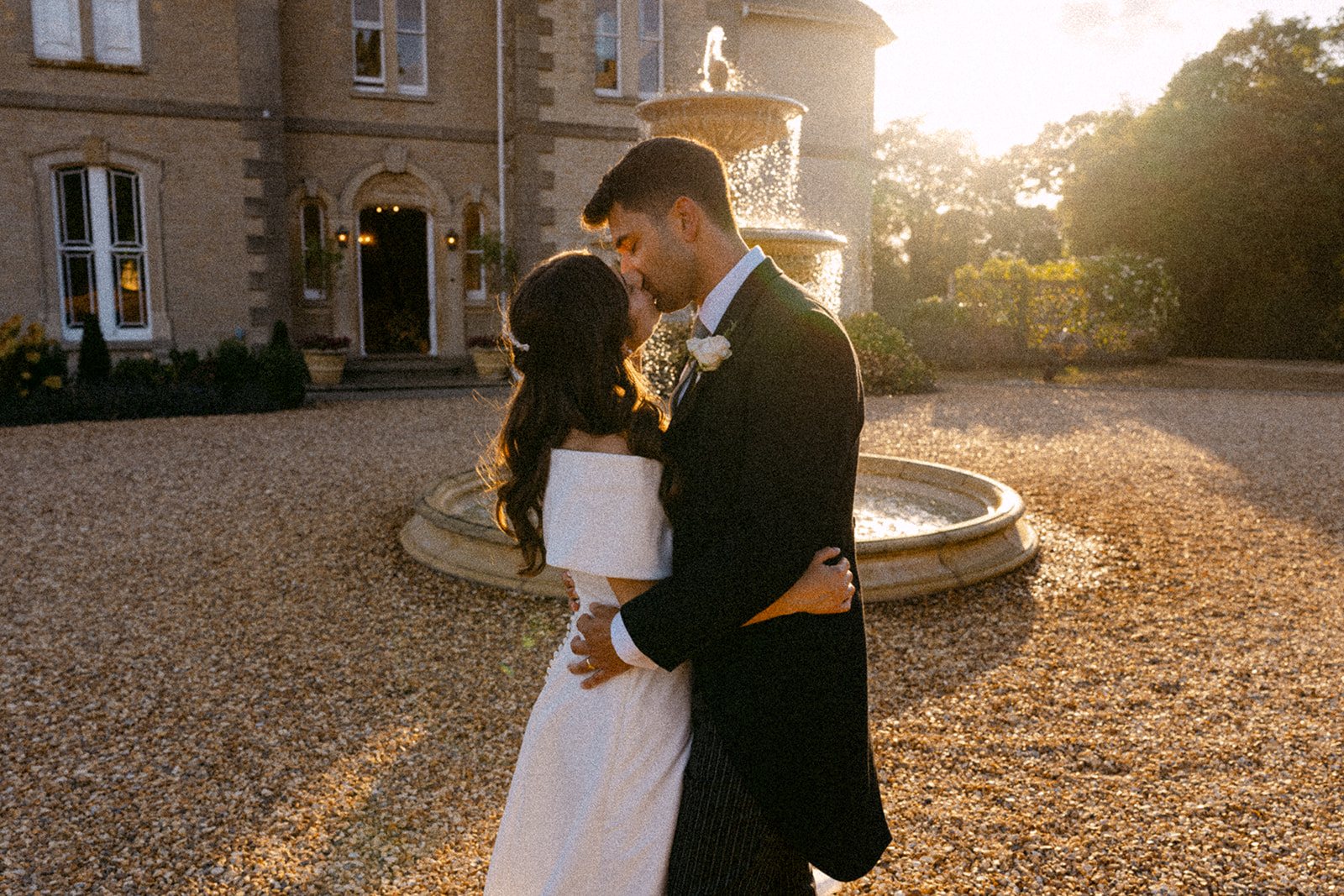 Jess and Tom by the fountain as the sun goes down